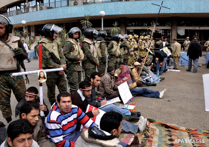 Egyptian Coptic Christians take part in a protest in front of the Information center building in Cairo, Egypt, 09 March 2011. The Coptic Christians were protesting over the burning of a church in Cairo suburbs on 04 Marc...