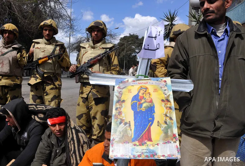 Egyptian Coptic Christians take part in a protest in front of the Information center building in Cairo, Egypt, 09 March 2011. The Coptic Christians were protesting over the burning of a church in Cairo suburbs on 04 Marc...