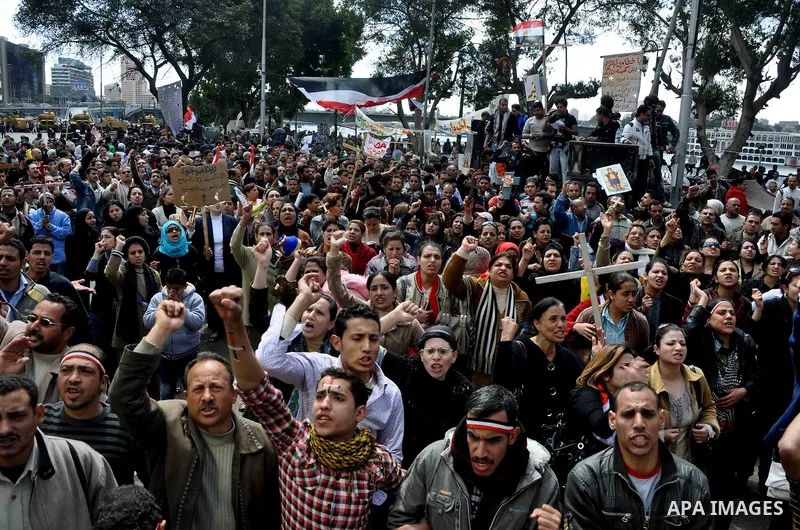 Egyptian Coptic Christians take part in a protest in front of the Information center building in Cairo, Egypt, 09 March 2011. The Coptic Christians were protesting over the burning of a church in Cairo suburbs on 04 Marc...