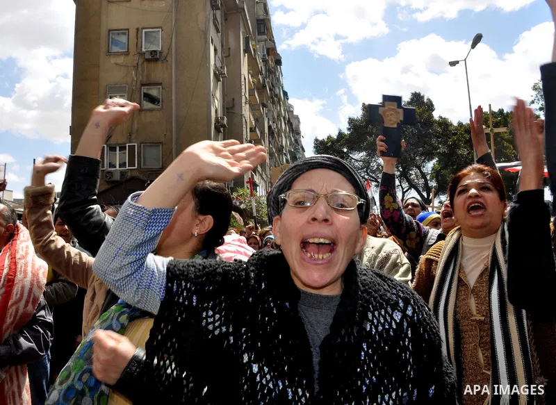 Egyptian Coptic Christians take part in a protest in front of the Information center building in Cairo, Egypt, 09 March 2011. The Coptic Christians were protesting over the burning of a church in Cairo suburbs on 04 Marc...