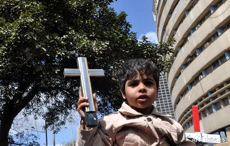 Egyptian Coptic Christians take part in a protest in front of the Information center building in Cairo, Egypt, 09 March 2011. The Coptic Christians were protesting over the burning of a church in Cairo suburbs on 04 Marc...