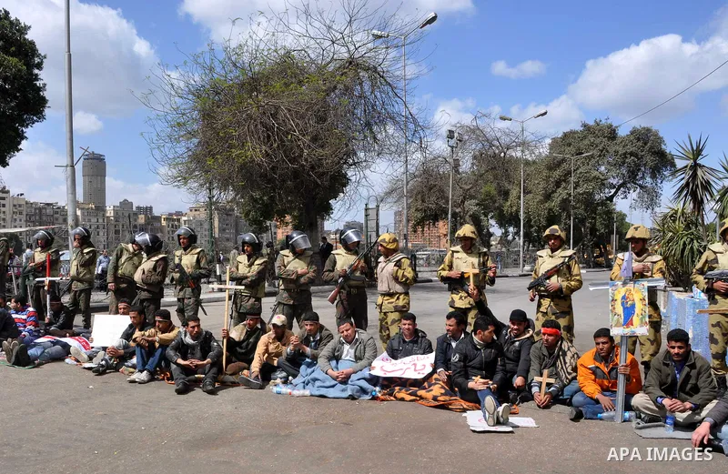 Egyptian Coptic Christians take part in a protest in front of the Information center building in Cairo, Egypt, 09 March 2011. The Coptic Christians were protesting over the burning of a church in Cairo suburbs on 04 Marc...