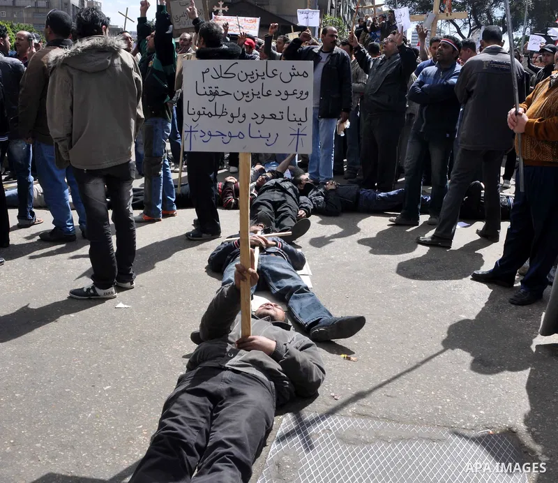 Egyptian Coptic Christians take part in a protest in front of the Information center building in Cairo, Egypt, 09 March 2011. The Coptic Christians were protesting over the burning of a church in Cairo suburbs on 04 Marc...