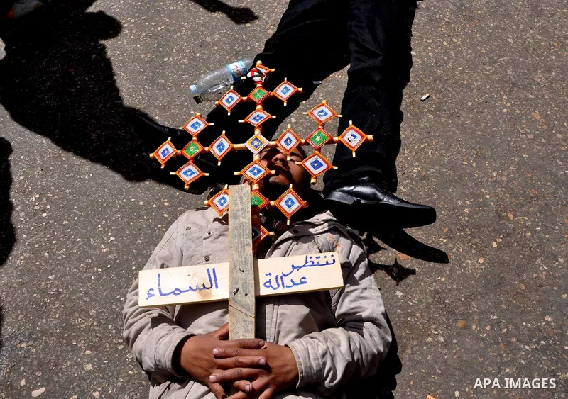 Egyptian Coptic Christians take part in a protest in front of the Information center building in Cairo, Egypt, 09 March 2011. The Coptic Christians were protesting over the burning of a church in Cairo suburbs on 04 Marc...