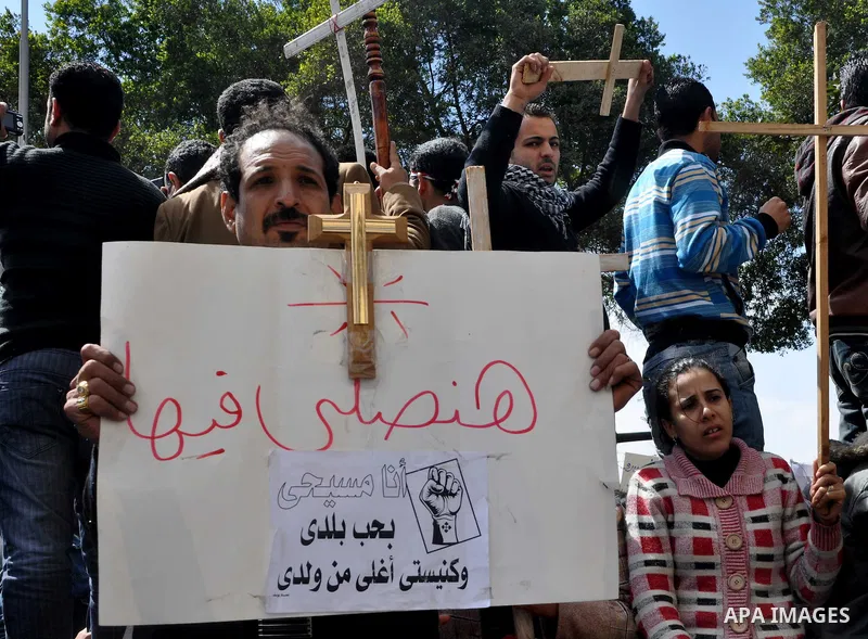 Egyptian Coptic Christians take part in a protest in front of the Information center building in Cairo, Egypt, 09 March 2011. The Coptic Christians were protesting over the burning of a church in Cairo suburbs on 04 Marc...