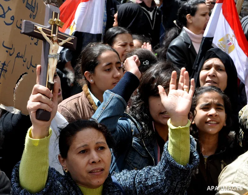 Egyptian Coptic Christians take part in a protest in front of the Information center building in Cairo, Egypt, 09 March 2011. The Coptic Christians were protesting over the burning of a church in Cairo suburbs on 04 Marc...