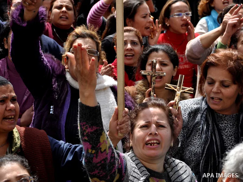 Egyptian Coptic Christians take part in a protest in front of the Information center building in Cairo, Egypt, 09 March 2011. The Coptic Christians were protesting over the burning of a church in Cairo suburbs on 04 Marc...