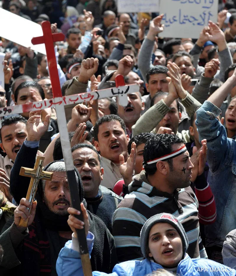 Egyptian Coptic Christians take part in a protest in front of the Information center building in Cairo, Egypt, 09 March 2011. The Coptic Christians were protesting over the burning of a church in Cairo suburbs on 04 Marc...