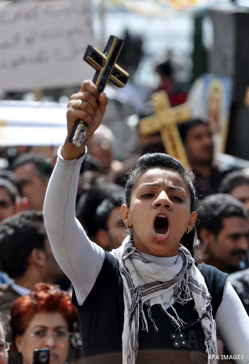 Egyptian Coptic Christians take part in a protest in front of the Information center building in Cairo, Egypt, 09 March 2011. The Coptic Christians were protesting over the burning of a church in Cairo suburbs on 04 Marc...