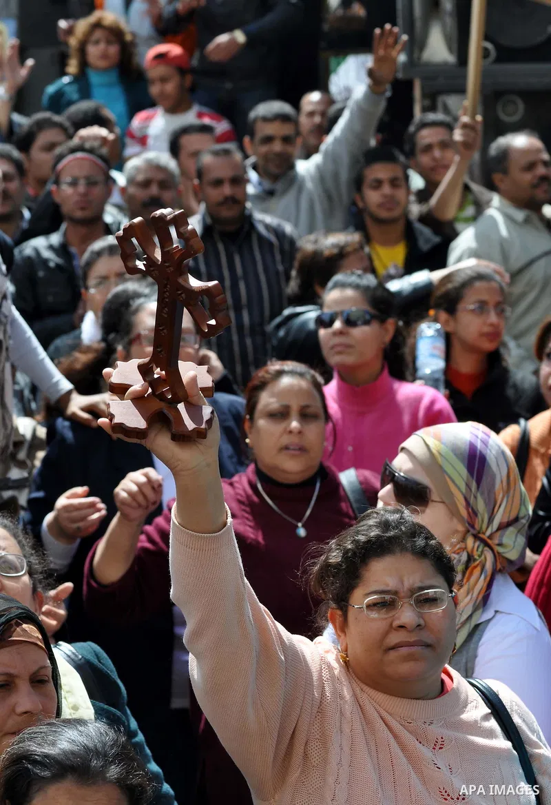Egyptian Coptic Christians take part in a protest in front of the Information center building in Cairo, Egypt, 09 March 2011. The Coptic Christians were protesting over the burning of a church in Cairo suburbs on 04 Marc...