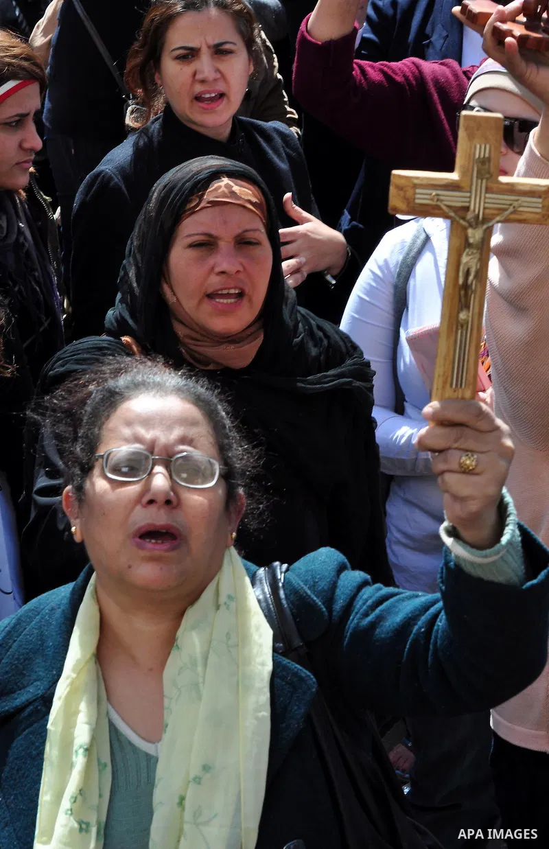 Egyptian Coptic Christians take part in a protest in front of the Information center building in Cairo, Egypt, 09 March 2011. The Coptic Christians were protesting over the burning of a church in Cairo suburbs on 04 Marc...