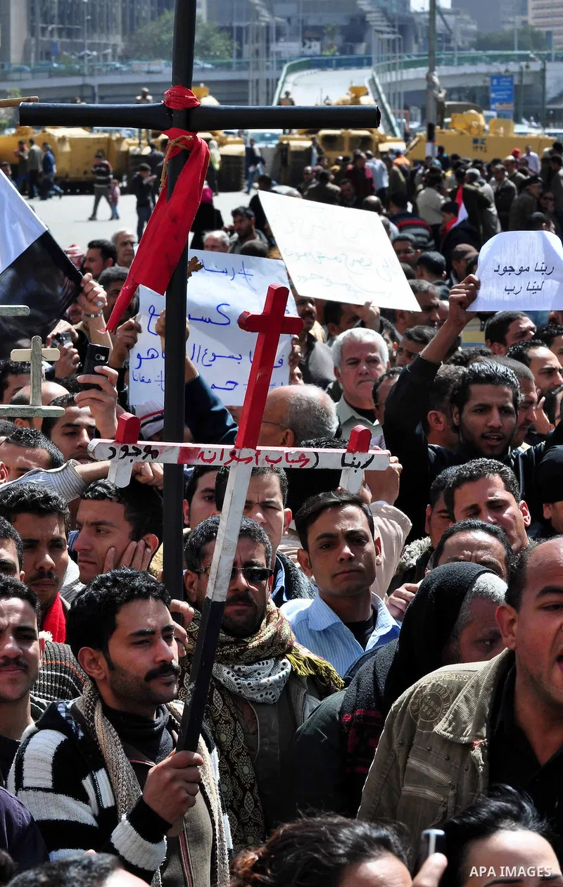 Egyptian Coptic Christians take part in a protest in front of the Information center building in Cairo, Egypt, 09 March 2011. The Coptic Christians were protesting over the burning of a church in Cairo suburbs on 04 Marc...
