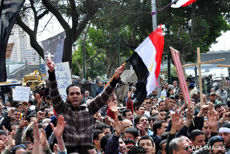 Egyptian Coptic Christians take part in a protest in front of the Information center building in Cairo, Egypt, 09 March 2011. The Coptic Christians were protesting over the burning of a church in Cairo suburbs on 04 Marc...