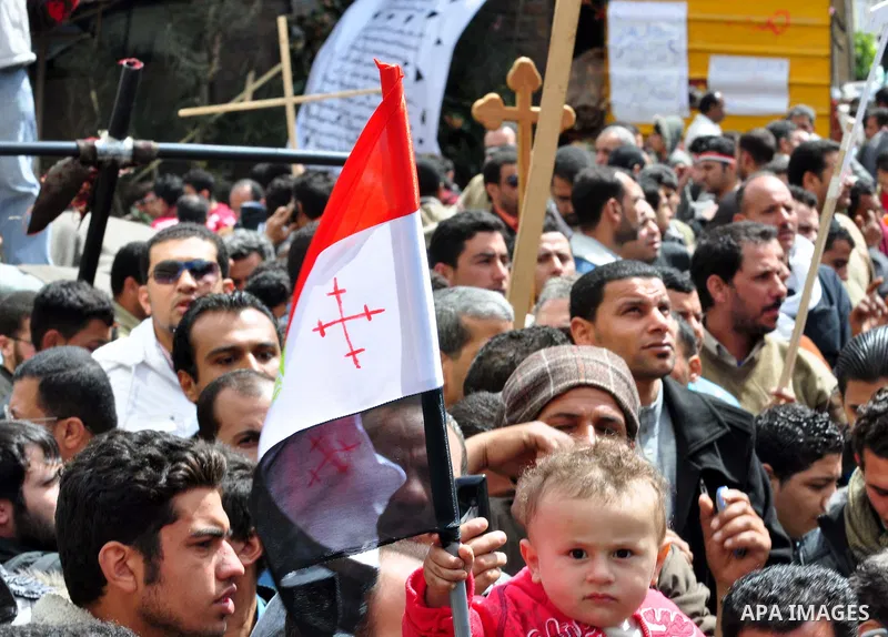 Egyptian Coptic Christians take part in a protest in front of the Information center building in Cairo, Egypt, 09 March 2011. The Coptic Christians were protesting over the burning of a church in Cairo suburbs on 04 Marc...