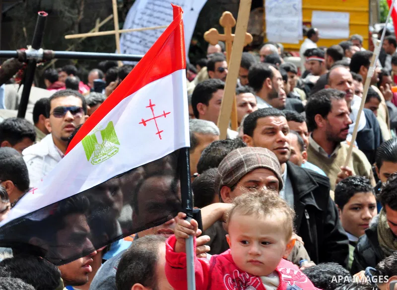 Egyptian Coptic Christians take part in a protest in front of the Information center building in Cairo, Egypt, 09 March 2011. The Coptic Christians were protesting over the burning of a church in Cairo suburbs on 04 Marc...