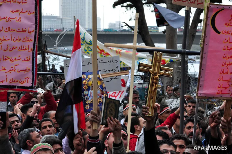 Egyptian Coptic Christians take part in a protest in front of the Information center building in Cairo, Egypt, 09 March 2011. The Coptic Christians were protesting over the burning of a church in Cairo suburbs on 04 Marc...