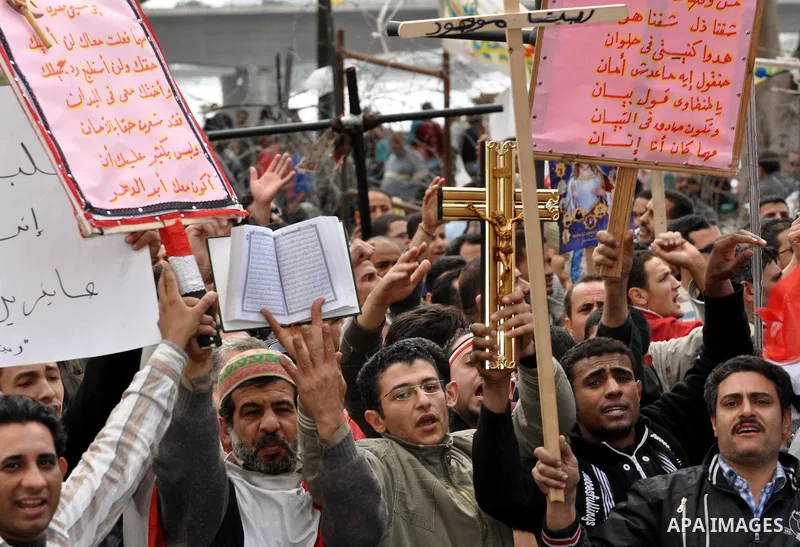 Egyptian Coptic Christians take part in a protest in front of the Information center building in Cairo, Egypt, 09 March 2011. The Coptic Christians were protesting over the burning of a church in Cairo suburbs on 04 Marc...
