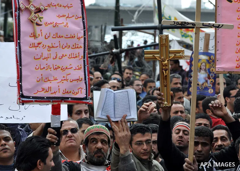 Egyptian Coptic Christians take part in a protest in front of the Information center building in Cairo, Egypt, 09 March 2011. The Coptic Christians were protesting over the burning of a church in Cairo suburbs on 04 Marc...