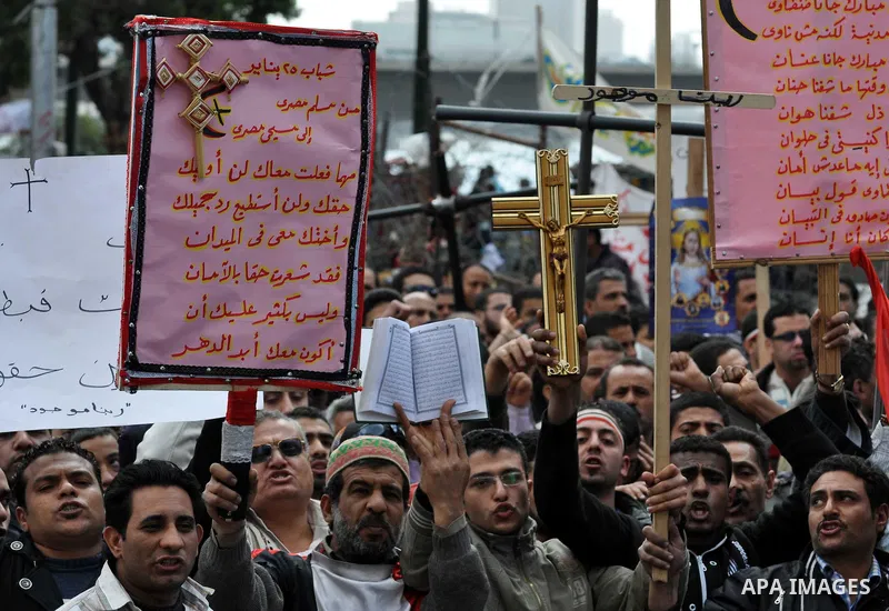 Egyptian Coptic Christians take part in a protest in front of the Information center building in Cairo, Egypt, 09 March 2011. The Coptic Christians were protesting over the burning of a church in Cairo suburbs on 04 Marc...