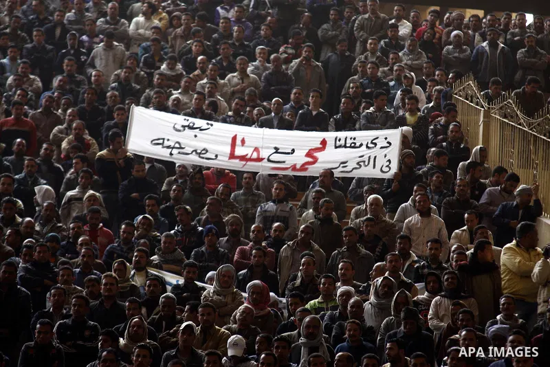 Egyptian Coptic Christians gather for a mass funeral procession at the Samaan el-Kharaz Church in Cairo on March 10, 2011 after at least 13 people were killed in sectarian clashes which erupted when 1,000 Christians gath...