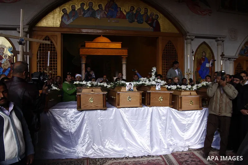 Egyptian Coptic Christians gather for a mass funeral procession at the Samaan el-Kharaz Church in Cairo on March 10, 2011 after at least 13 people were killed in sectarian clashes which erupted when 1,000 Christians gath...
