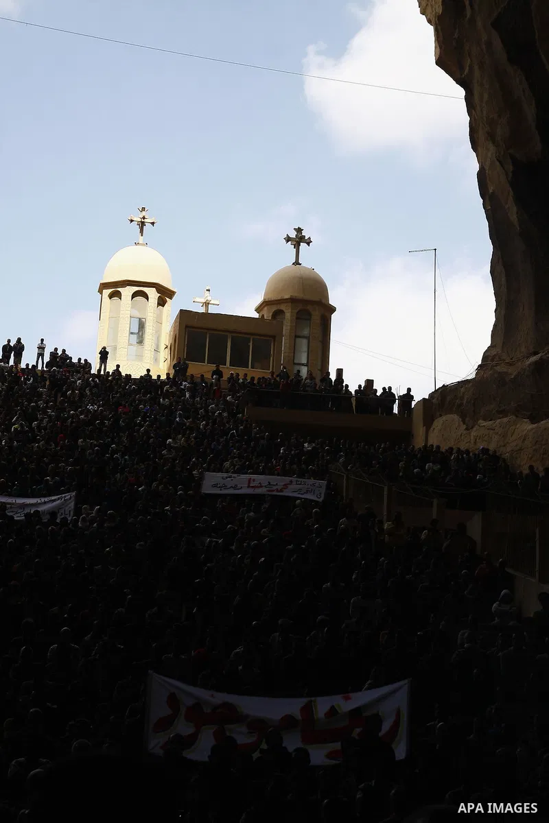Egyptian Coptic Christians gather for a mass funeral procession at the Samaan el-Kharaz Church in Cairo on March 10, 2011 after at least 13 people were killed in sectarian clashes which erupted when 1,000 Christians gath...
