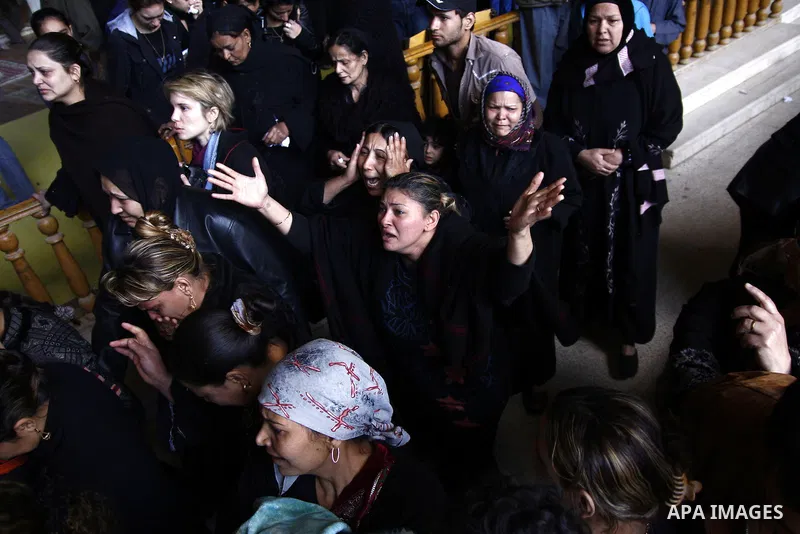 Egyptian Coptic Christians gather for a mass funeral procession at the Samaan el-Kharaz Church in Cairo on March 10, 2011 after at least 13 people were killed in sectarian clashes which erupted when 1,000 Christians gath...