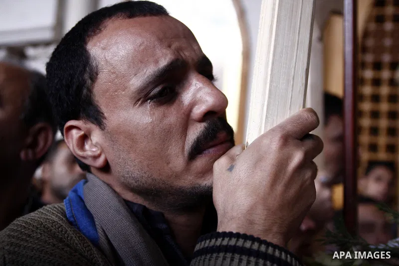 Egyptian Coptic Christians gather for a mass funeral procession at the Samaan el-Kharaz Church in Cairo on March 10, 2011 after at least 13 people were killed in sectarian clashes which erupted when 1,000 Christians gath...