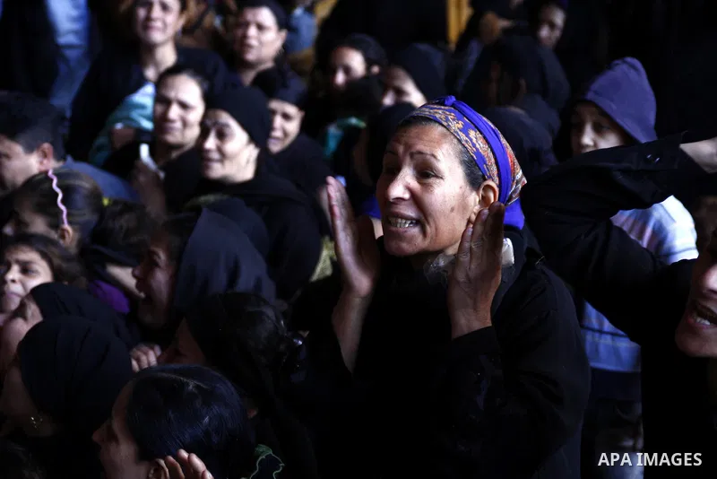 Egyptian Coptic Christians gather for a mass funeral procession at the Samaan el-Kharaz Church in Cairo on March 10, 2011 after at least 13 people were killed in sectarian clashes which erupted when 1,000 Christians gath...