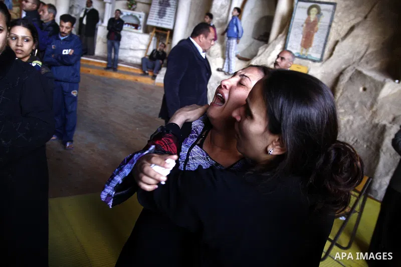 Egyptian Coptic Christians gather for a mass funeral procession at the Samaan el-Kharaz Church in Cairo on March 10, 2011 after at least 13 people were killed in sectarian clashes which erupted when 1,000 Christians gath...