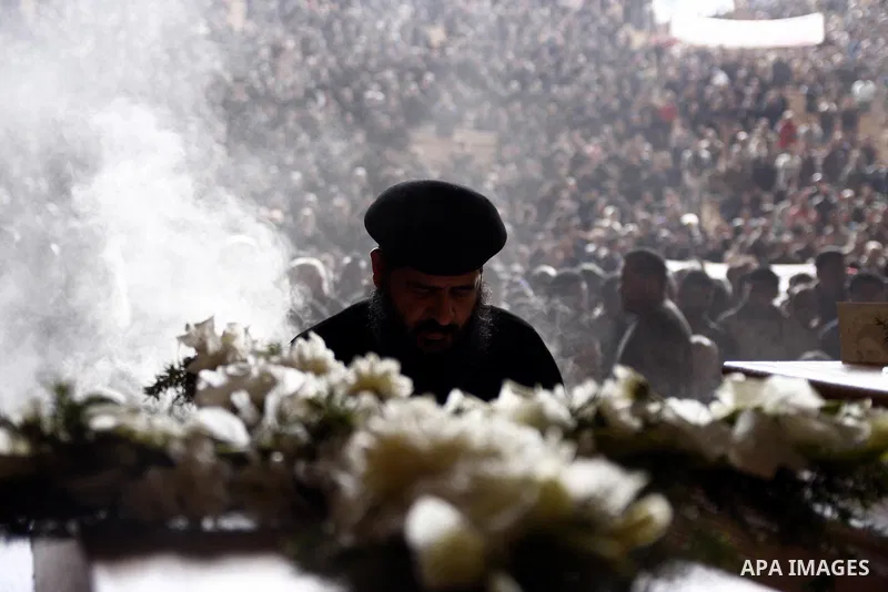 Egyptian Coptic Christians gather for a mass funeral procession at the Samaan el-Kharaz Church in Cairo on March 10, 2011 after at least 13 people were killed in sectarian clashes which erupted when 1,000 Christians gath...