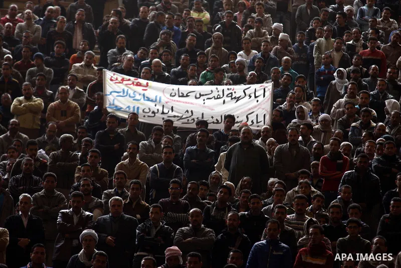 Egyptian Coptic Christians gather for a mass funeral procession at the Samaan el-Kharaz Church in Cairo on March 10, 2011 after at least 13 people were killed in sectarian clashes which erupted when 1,000 Christians gath...