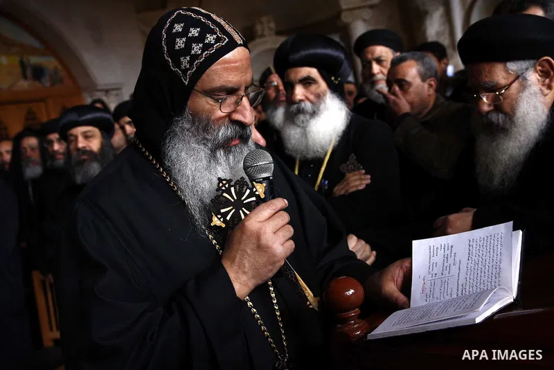 Egyptian Coptic Christians gather for a mass funeral procession at the Samaan el-Kharaz Church in Cairo on March 10, 2011 after at least 13 people were killed in sectarian clashes which erupted when 1,000 Christians gath...