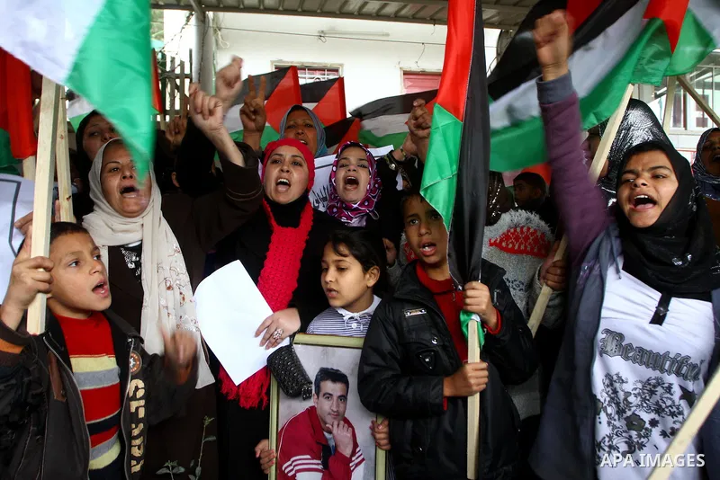 Palestinian women take part in a demonstration organized by the Democratic Front for the Liberation of Palestine (DFLP), calling to end the Palestinian internal division between Hamas and Fatah, outside the International...