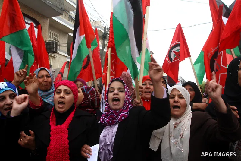 Palestinian women take part in a demonstration organized by the Democratic Front for the Liberation of Palestine (DFLP), calling to end the Palestinian internal division between Hamas and Fatah, outside the International...