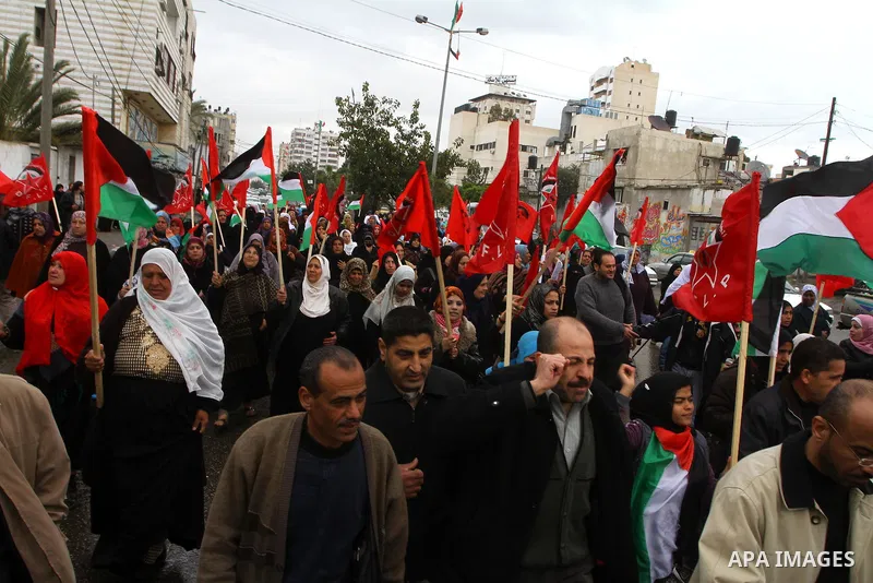 Palestinian women take part in a demonstration organized by the Democratic Front for the Liberation of Palestine (DFLP), calling to end the Palestinian internal division between Hamas and Fatah, outside the International...