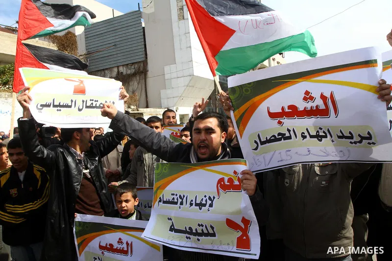 Palestinians attend a rally calling for national reconciliation between the rival Palestinian leading factions Hamas in Gaza and Fatah in the West Bank, in Gaza City, Friday, March 11, 2011. Members of major Palestinian...