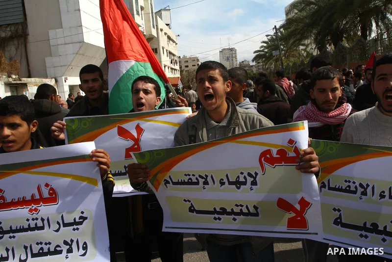 Palestinians attend a rally calling for national reconciliation between the rival Palestinian leading factions Hamas in Gaza and Fatah in the West Bank, in Gaza City, Friday, March 11, 2011. Members of major Palestinian...