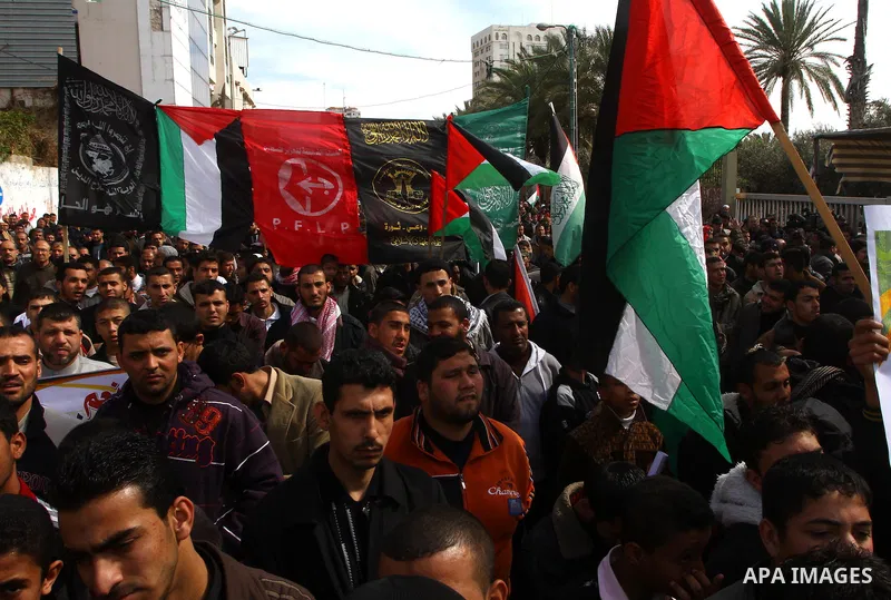 Palestinians attend a rally calling for national reconciliation between the rival Palestinian leading factions Hamas in Gaza and Fatah in the West Bank, in Gaza City, Friday, March 11, 2011. Members of major Palestinian...