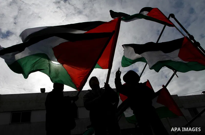 Palestinians attend a rally calling for national reconciliation between the rival Palestinian leading factions Hamas in Gaza and Fatah in the West Bank, in Gaza City, Friday, March 11, 2011. Members of major Palestinian...
