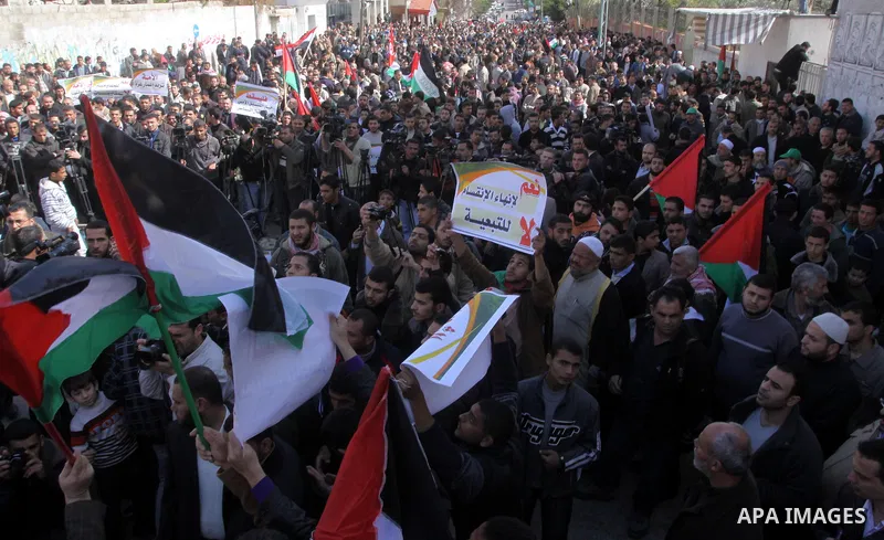 Palestinians attend a rally calling for national reconciliation between the rival Palestinian leading factions Hamas in Gaza and Fatah in the West Bank, in Gaza City, Friday, March 11, 2011. Members of major Palestinian...