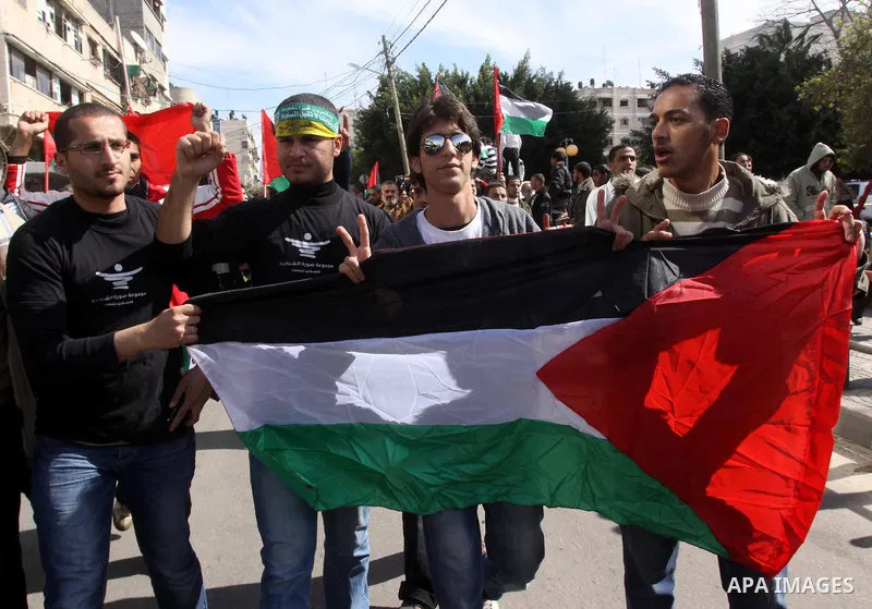Palestinians attend a rally calling for national reconciliation between the rival Palestinian leading factions Hamas in Gaza and Fatah in the West Bank, in Gaza City, Friday, March 11, 2011. Members of major Palestinian...