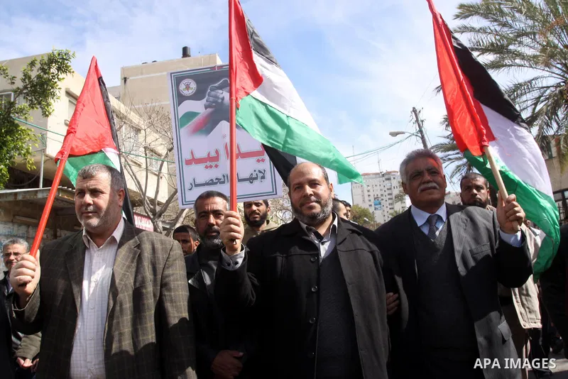 Palestinians attend a rally calling for national reconciliation between the rival Palestinian leading factions Hamas in Gaza and Fatah in the West Bank, in Gaza City, Friday, March 11, 2011. Members of major Palestinian...