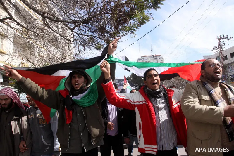 Palestinians attend a rally calling for national reconciliation between the rival Palestinian leading factions Hamas in Gaza and Fatah in the West Bank, in Gaza City, Friday, March 11, 2011. Members of major Palestinian...