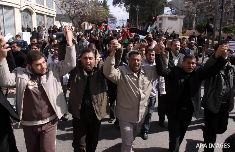 Palestinians attend a rally calling for national reconciliation between the rival Palestinian leading factions Hamas in Gaza and Fatah in the West Bank, in Gaza City, Friday, March 11, 2011. Members of major Palestinian...