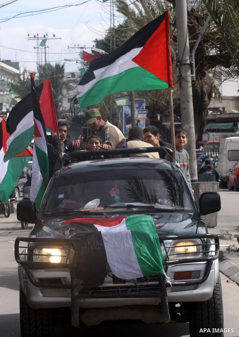 Palestinians attend a rally calling for national reconciliation between the rival Palestinian leading factions Hamas in Gaza and Fatah in the West Bank, in Gaza City, Friday, March 11, 2011. Members of major Palestinian...