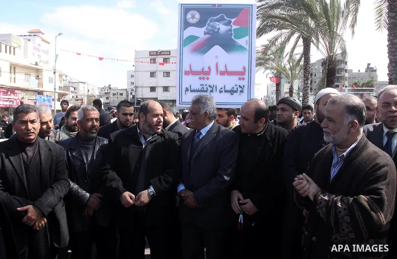 Palestinians attend a rally calling for national reconciliation between the rival Palestinian leading factions Hamas in Gaza and Fatah in the West Bank, in Gaza City, Friday, March 11, 2011. Members of major Palestinian...