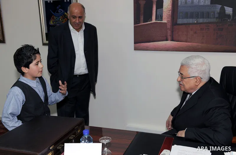 President Mahmoud Abbas (Abu Mazen) meets the child Issam Bashiti in Ramallah March 12, 2011. Photo by Thaer Ganaim