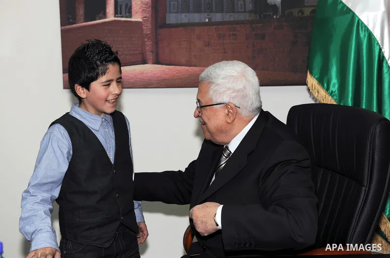 President Mahmoud Abbas (Abu Mazen) meets the child Issam Bashiti in Ramallah March 12, 2011. Photo by Thaer Ganaim