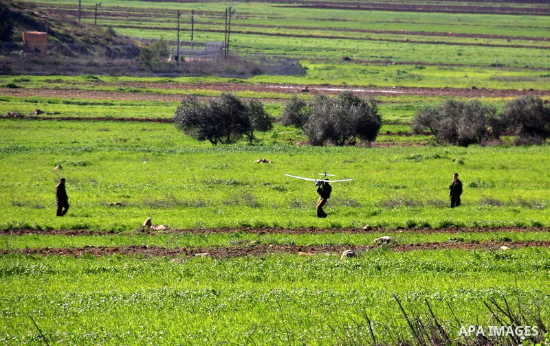 Israeli soldiers launch a drone near the West Bank village of Awarta on March 12, 2011 as troops were hunting a suspected Palestinian who killed five members of an Israeli family at a settlement, officials and media repo...